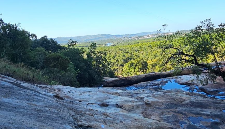 The Lowveld around Kanaan — smooth rock outcrops, valley forest and farmland rolling toward the escarpment.